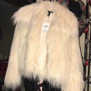 Brand new faux fur coat with tags